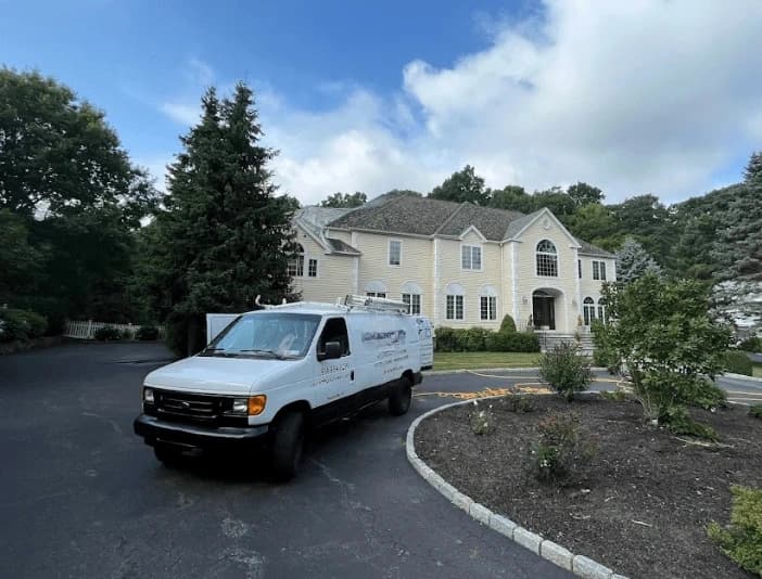 Cleveland Heights Power Washing technician performing thorough gutter cleaning service in Cleveland Heights