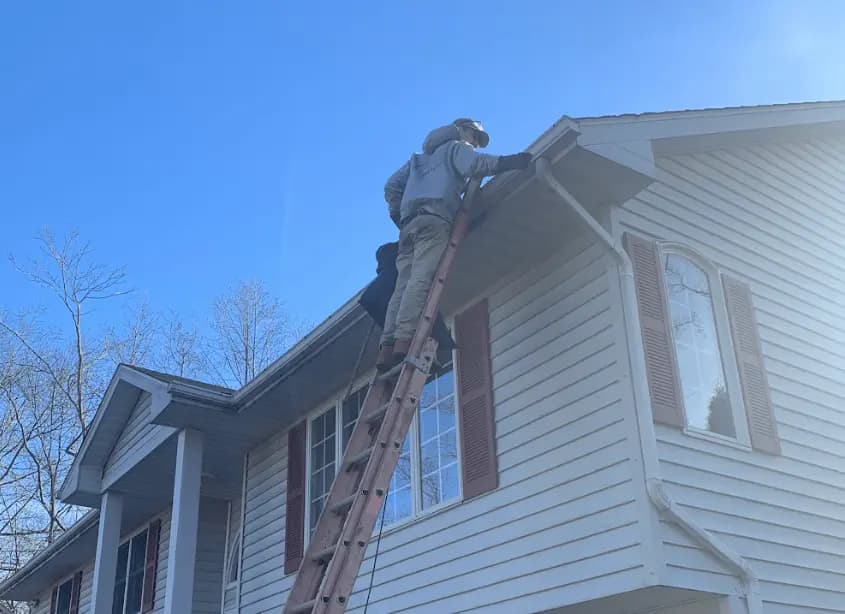 Gutter cleaning and maintenance being performed by Cleveland Heights Power Washing in Cleveland Heights